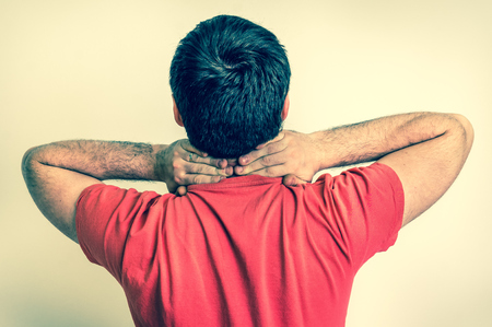 Man having pain in his neck - retro styleの写真素材