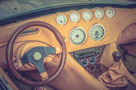 Steering wheel, shift lever and dashboard inside the luxury car - retro and vintage styleの写真素材