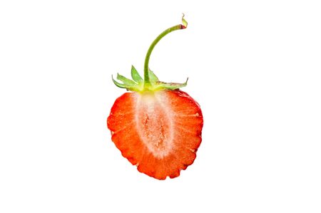 One half of fresh strawberry isolated on a white backgroundの写真素材