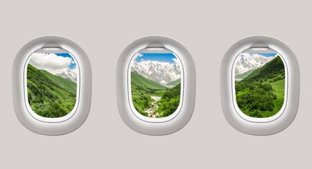 Looking out the windows of a plane to the mountains in Georgia (Svaneti)の写真素材