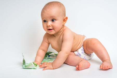Cute baby with euro bills moneyの写真素材