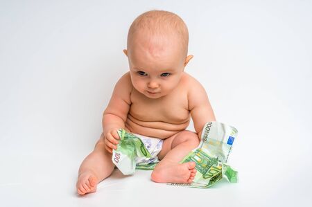 Cute baby with euro bills money isolated on white backgroundの写真素材