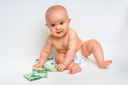 Cute baby with euro bills money isolated on white backgroundの写真素材