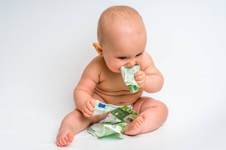 Adorable baby with euro bills money isolated on white backgroundの写真素材