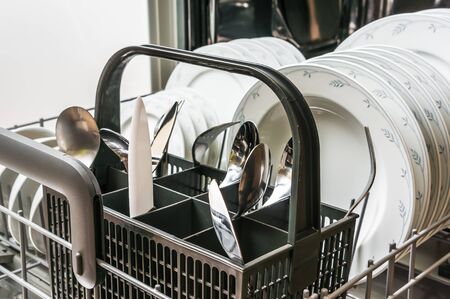 Open dishwasher with clean dishes after cleaning process - selective focusの写真素材