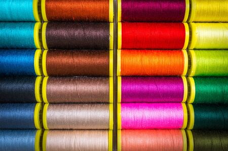 Multicolor sewing threads background - concept of sewingの写真素材