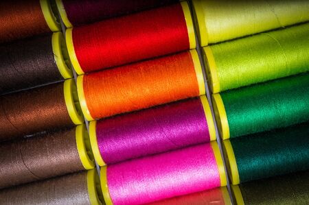 Multicolor sewing threads background - concept of sewingの写真素材