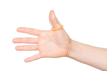 Condom on female thumb isolated on white backgroundの写真素材