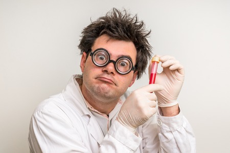 Young crazy scientist performing experiments in laboratoryの写真素材