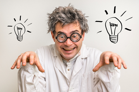 Funny and crazy scientist with glasses and grey hairの写真素材