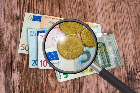 Euro money background with magnifying glass, euro banknotesの写真素材