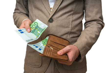 Businessman hands holding wallet with stack of euro bills moneyの写真素材