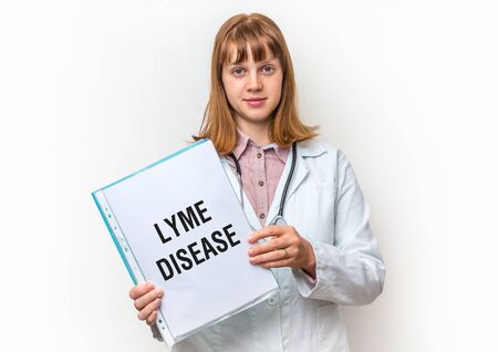 Female doctor showing medical clipboard with written text: Lyme Disease - isolated on white backgroundの写真素材