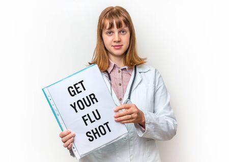 Female doctor showing medical clipboard with written text: Get Your Flu Shot - isolated on white backgroundの写真素材