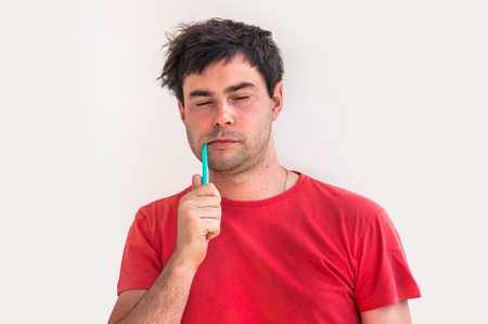 Young man brushing teeth in the morning - dental hygieneの写真素材