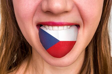 Woman with czech flag on the tongue - learning a foreign languageの写真素材