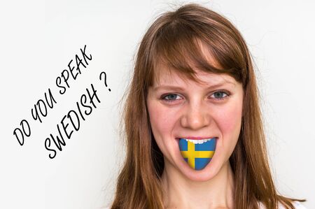 Do you speak Swedish? Woman with flag on the tongue - isolated on white backgroundの写真素材