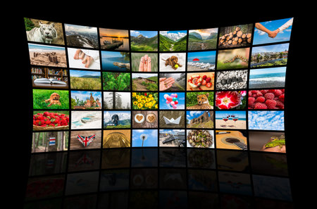 Screens forming a big multimedia broadcast video wall - broadcasting and multimedia concept