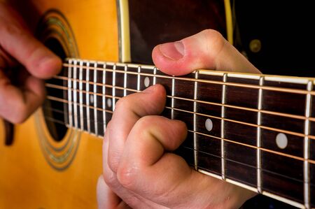 Man playing acoustic guitar. Close up guitar.の写真素材