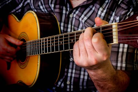 Man playing acoustic guitar. Close up guitar.の写真素材
