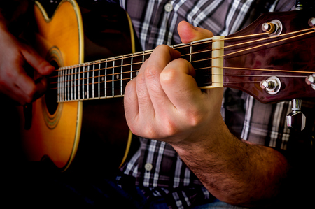 Man playing acoustic guitar. Close up guitar.の写真素材