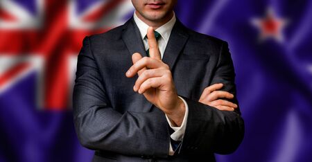 New Zealand candidate speaks to the people crowd with one finger on lips - election in New Zealandの写真素材