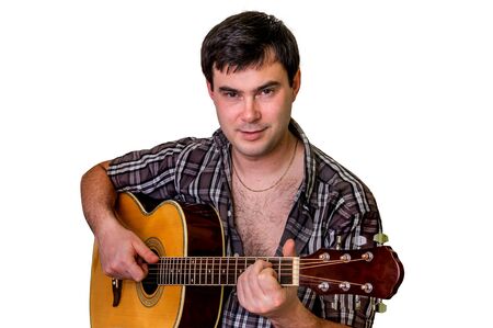 Young man playing acoustic guitar - isolated on white backgroundの写真素材