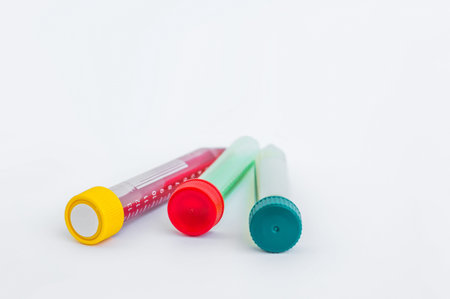 Test-tube with fluid on gray background