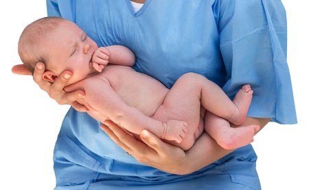 Doctor holding a beautiful newborn baby isolated od white backgroundの写真素材