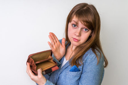 Business woman holding an empty wallet, she hasn't money