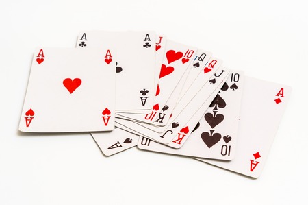 Playing cards isolated on white background - casino gambling conceptの写真素材