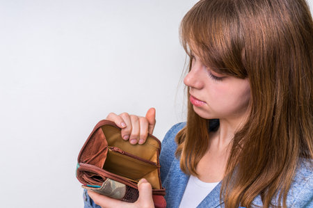 Business woman holding an empty wallet, she hasn't money