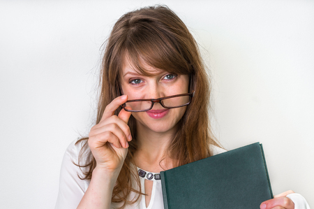 Success graduate woman with her thesis work on white - education conceptの写真素材