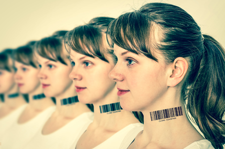 A lot of women in a row with barcode on neck - genetic clone concept - retro styleの写真素材