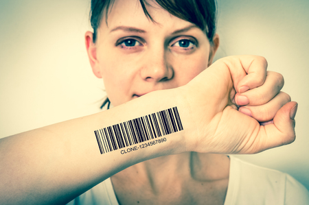 Young woman with barcode on her hand - genetic clone concept - retro styleの写真素材