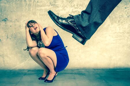 Scared and shocked small business woman under boss pressure - retro styleの写真素材