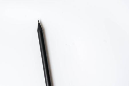 One black pencil isolated on white backgroundの写真素材