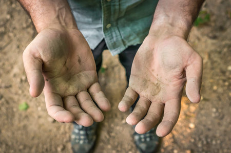 Dirty hands of a worker man after hard workの写真素材