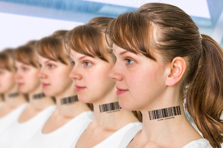 A lot of women in a row with barcode on neck - genetic clone conceptの写真素材