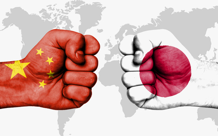 Conflict between China and Japan, male fists - governments conflict conceptの写真素材