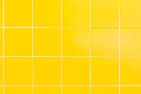 Yellow ceramic tiles background in bathroom at homeの写真素材