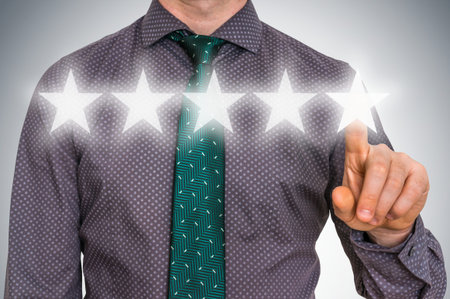 Businessman is giving a five stars rating - review and ranking concept