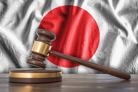 Wooden gavel and flag of Japan on background - law concept. 3D rendered illustration.の写真素材