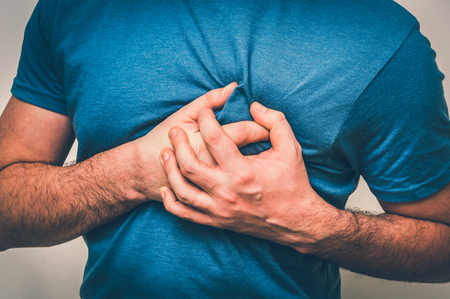 Man having chest pain, heart attack - body pain concept - retro styleの写真素材