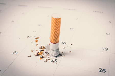 Cigarette on a calendar background - quit smoking - retro styleの写真素材