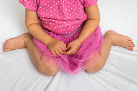 Child sitting in bad position, which is called W-sitting. W-sitting can cause to hip dislocation.の写真素材