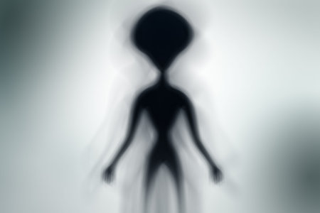 Silhouette of spooky alien and bright light on behind him - UFO conceptの写真素材
