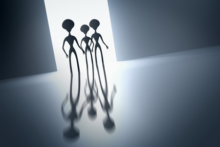 Silhouettes of spooky aliens and bright light on behind them - UFO conceptの写真素材