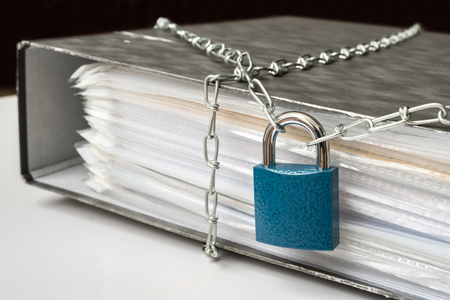 Files locked with chain and padlock - data and privacy security conceptの写真素材