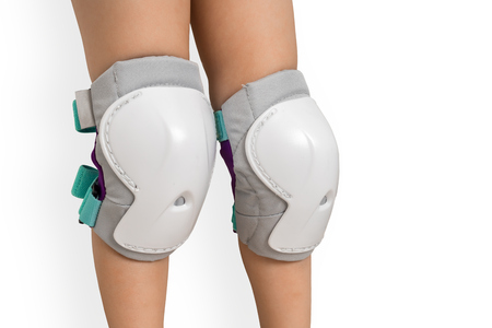 Pair of knee pads wearing on legs of child - protectors for kneesの写真素材